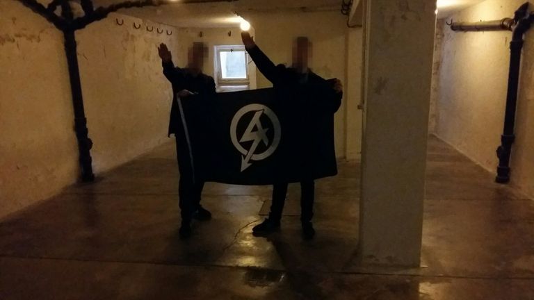 Alex Davies and Mark Jones giving a Nazi salute in the execution chamber of Buchenwald concentration camp in April 2016 in an image shown to the jury in Davies&#39;s trial for membership of a proscribed organisation. 