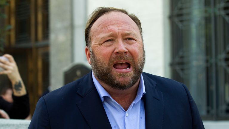 FILE - Alex Jones speaks to reporters in Washington, Sept. 5, 2018. Infowars filed for Chapter 11 bankruptcy protection on Sunday, April 17, 2022, in Texas as its founder and conspiracy theorist Alex Jones faces defamation lawsuits over his comments that the Sandy Hook Elementary School shooting was a hoax. (AP Photo/Jose Luis Magana, File)