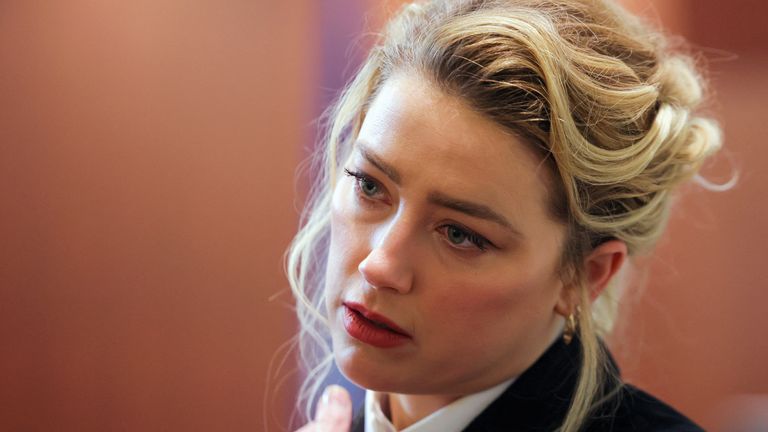 Actor Amber Heard looks on during Johnny Depp&#39;s defamation trial against her at the Fairfax County Circuit Courthouse in Fairfax, Virginia, U.S., April 13, 2022. REUTERS/Evelyn Hockstein/Pool
