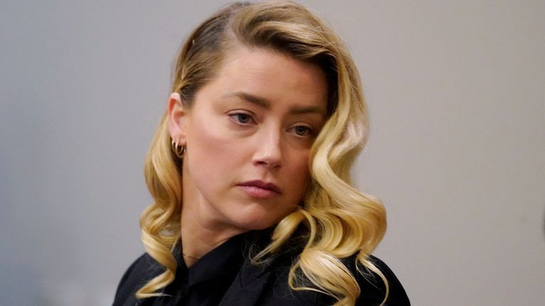 Actor Amber Heard listens in the courtroom during Johnny Depp&#39;s defamation case against her at the Fairfax County Circuit Court in Fairfax, Virginia, U.S., April 18, 2022. Steve Helber/Pool via REUTERS
