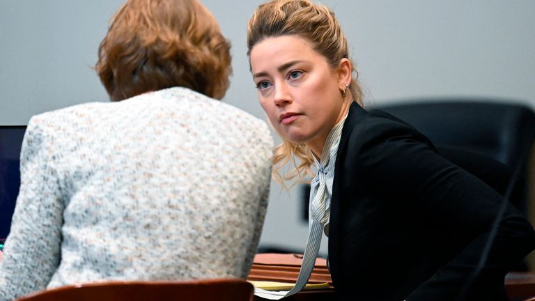US actress Amber Heard speaks to her attorney at the Fairfax County Circuit Courthouse in Fairfax, Virginia, on April 19, 2022. - US actor Johnny Depp is suing ex-wife Heard for libel after she wrote an op-ed piece in The Washington Post in 2018 referring to herself as a ..public figure representing domestic abuse... (Photo by Jim WATSON / POOL / AFP)
PIC:AP
