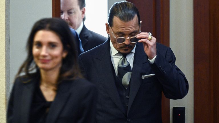 Actor Johnny Depp arrives at the Fairfax County Circuit Courthouse for his defamation trial against ex-wife Amber Heard, in Fairfax, Virginia, U.S., April 25, 2022. Brendan Smialowski/ Pool via REUTERS
