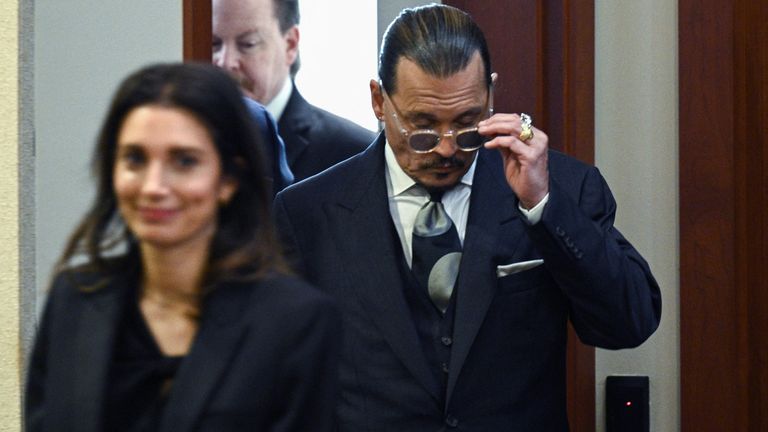 Actor Johnny Depp arrives at Fairfax County Courthouse for his defamation trial against ex-wife Amber Heard, in Fairfax, Virginia, U.S., April 25, 2022. Brendan Smialowski / Pool via REUTERS