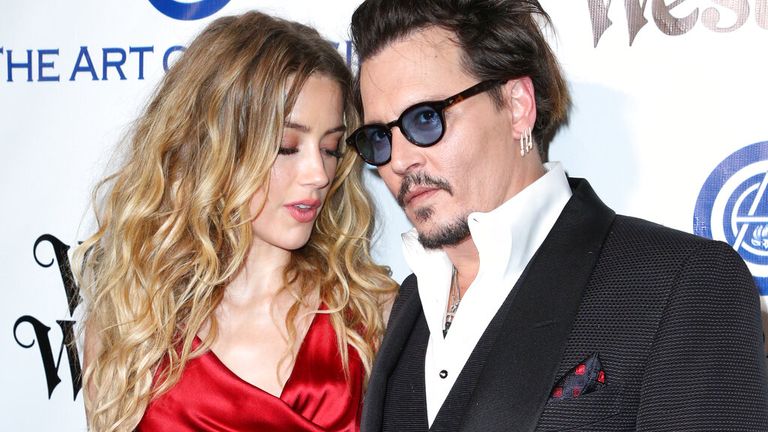 Amber Heard and Johnny Depp pictured in January 2016, just a few months before their break-up. Pic: AP