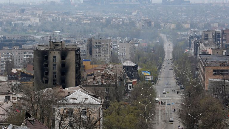 A view shows damaged buildings with a plant of Azovstal Iron and Steel Works company in the background, during Ukraine-Russia conflict in the southern port city of Mariupol, Ukraine April 19, 2022. REUTERS/Alexander Ermochenko
