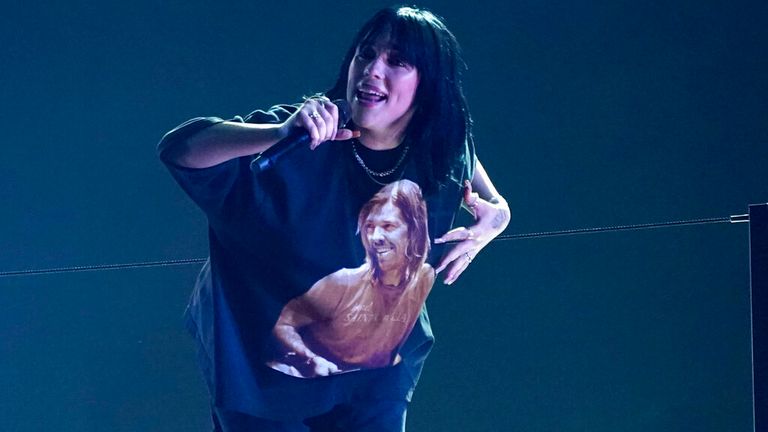 Billie Eilish wears a T-shirt featuring the late Foo Fighters drummer Taylor Hawkins as she performs Happier Than Ever at the Grammys in Las Vegas. Pic: AP/Chris Pizzello