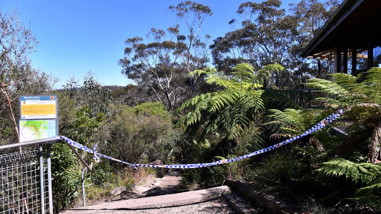 The entrance to the walking track where a landslide killed 2 and injured two others is tapped off at Wentworth Falls in the Blue Mountains, west of Sydney, Tuesday, April 5, 2022. A British family of five was caught in a landslide while walking in Australia&#39;s Blue Mountains, and the father and 9-year-old son died. (Dean Lewins/AAP Image via AP)   
PIC:AP