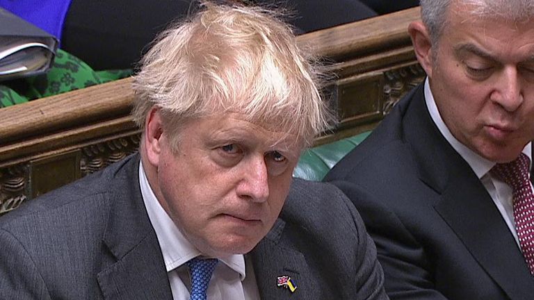 Boris Johnson listens to a question in parliament