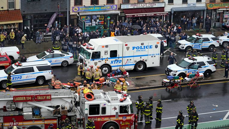 Emergency personnel gather at the entrance to the subway station in Brooklyn. Pic: AP