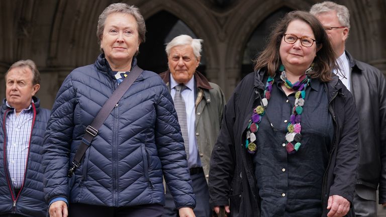 Cathy Gardner (2nd left) and Fay Harris (2nd right), whose fathers died from Covid-19, leave the Royal Courts of Justice