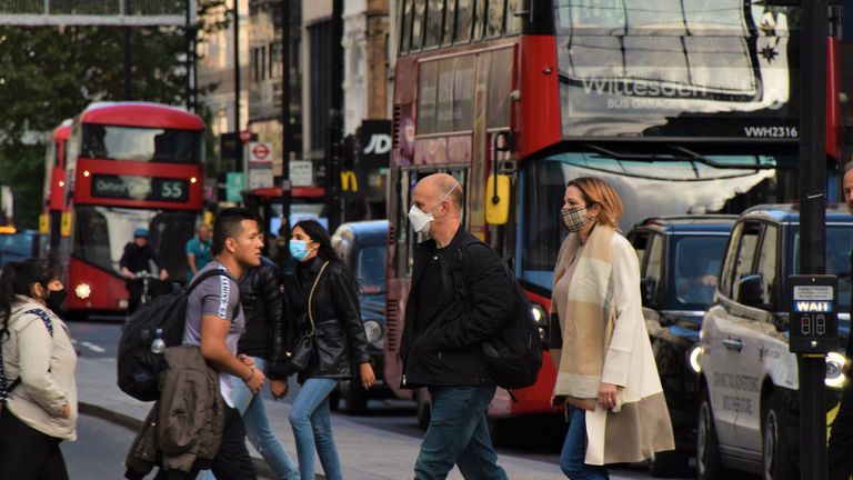 People wearing face masks on Oxford Street, London stock photo.. Pic: iStock

