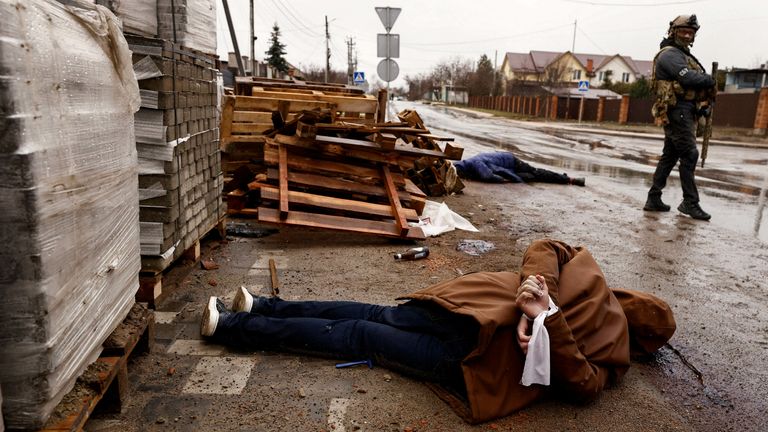 SENSITIVE MATERIAL. THIS IMAGE MAY OFFEND OR DISTURB A body with hands bound by white cloth, who according to residents was shot by Russian soldiers, lies in the street, amid Russia&#39;s invasion on Ukraine, in Bucha, Ukraine April 3, 2022. REUTERS/Zohra Bensemra
