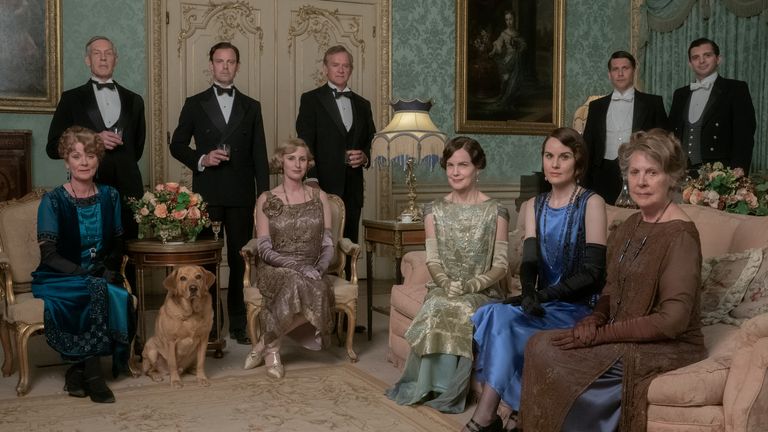 Samantha Bond stars as Lady Rosamund, Douglas Reith as Lord Merton, Harry Hadden-Paton as Lord Hexham, Laura Carmichael as Lady Edith Hexham, Hugh Bonneville as Lord Grantham, Elizabeth McGovern as Lady Grantham, Michelle Dockery as Lady Mary Talbot, Penelope Wilton as Lady Merton, Robert James Collier as Thomas Barrow and Michael Fox as Andy in DOWNTON ABBEY: A New Era, a Focus Features release.  ..Credit: Ben Blackall / .. 2021 Focus Features, LLC..