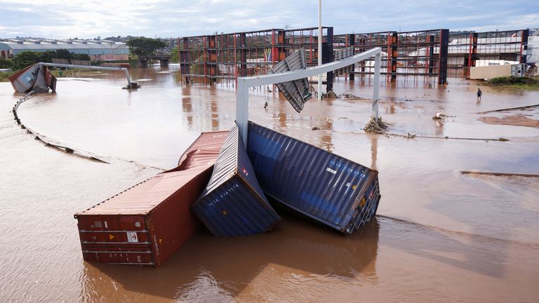 Shipping containers were washed away as the roads were swept away