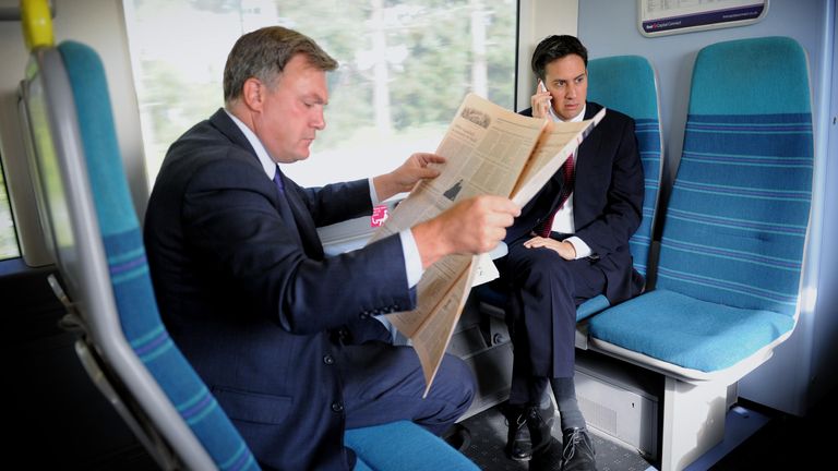 Labour leader Ed Miliband on a train to Luton with shadow chancellor Ed Balls in September 2011