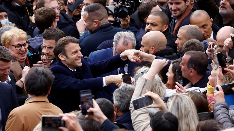 French President Emmanuel Macron, candidate for his re-election in the 2022 French presidential election, shakes hands with supporters during a campaign trip in Spezet, France, Avril 5, 2022. REUTERS/Stephane Mahe TPX IMAGES OF THE DAY

