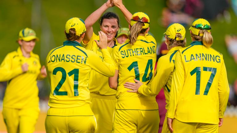 Tahlia Mcgrath of Australia, center, celebrates with teammates after taking the wicket of wicket of Deandra Dottin of the West Indies during their semifinal match of the Women&#39;s Cricket World Cup between Australia and West Indies in Wellington, New Zealand, Wednesday, March 30, 2022. (John Cowpland/Photosport via AP)


