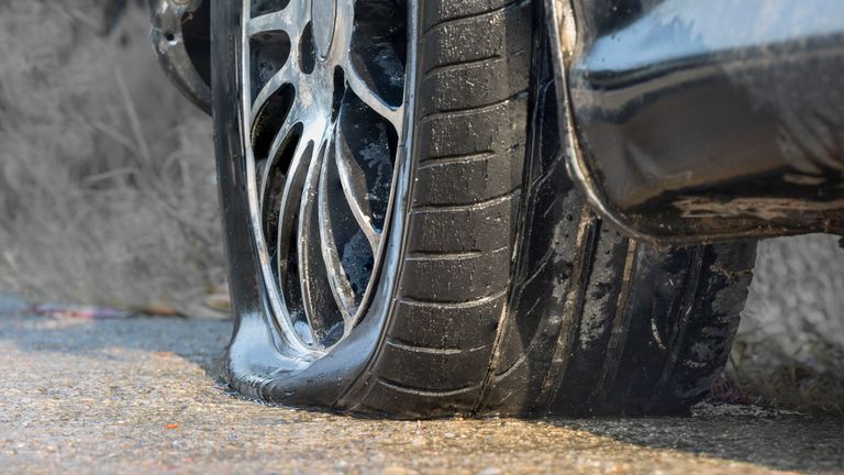 Car with flat tyre. Pic: iStock 