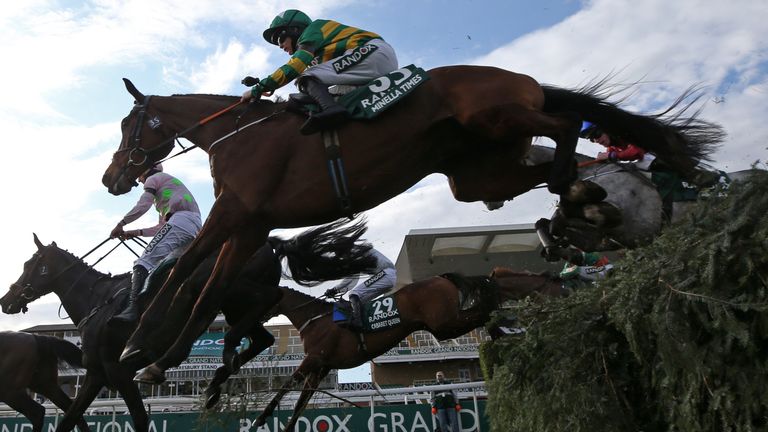 Rachael Blackmore riding Minella Times clears the water jump before winning the Randox Grand National Handicap Chase during Grand National Day of the 2021 Randox Health Grand National Festival at Aintree Racecourse, Liverpool. Picture date: Saturday April 10, 2021.