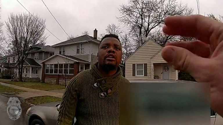 A Grand Rapids Police officer asks Patrick Lyoya if he speaks English, as he stands near a car during a traffic stop, shortly before he was shot dead by the officer during a scuffle on a suburban front lawn in Grand Rapids, Michigan, U.S. April 4, 2022 in a still image from police body camera video. Video taken April 4, 2022. Pic: Grand Rapids Police