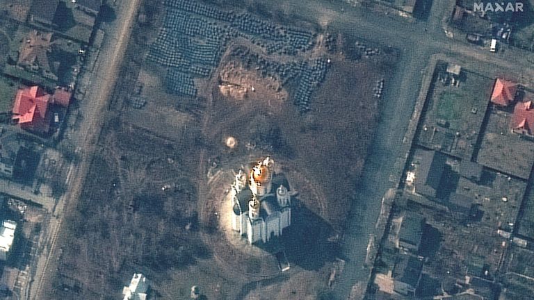 A satellite image shows the grave site with an approximately 45-foot (approximately 13,7 meters) long trench in the southwestern section of the area near the Church of St. Andrew and Pyervozvannoho All Saints, in Bucha, Ukraine