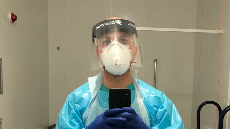 Undated handout photo issued by Hassan Akkad of himself, a Syrian photographer and filmmaker who has temporarily changed careers to spend his time disinfecting coronavirus wards at his local hospital.