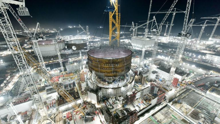 Handout photo dated 15/11/21 issued by EDF/CGN of Big Carl, the world&#39;s biggest crane, in action at Hinkley Point C nuclear power plant near Bridgwater in Somerset on Monday evening, as it placed the first huge steel ring section onto the second reactor building, just 11 months after the same operation on the first reactor. Issue date: Tuesday November 16, 2021.