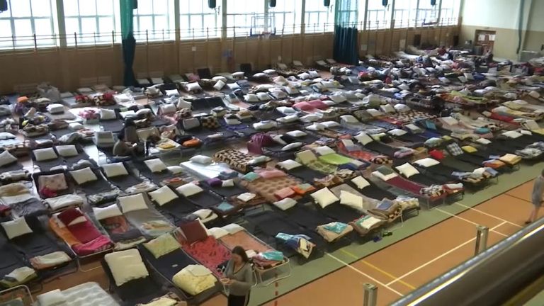 This gym in Poland is being used to house Ukrainian refugees, many who are waiting for UK visas