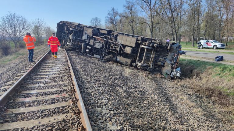 Five dead after train ploughs into flatbed truck and flips over in ...