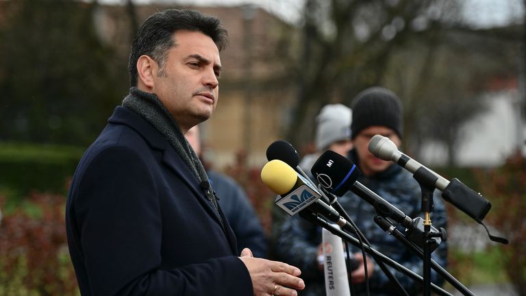 Opposition leader Peter Marki-Zay answers questions of journalists after voting in general election in Hodmezovasarhely, southern Hungary, Sunday, April 3, 2022.