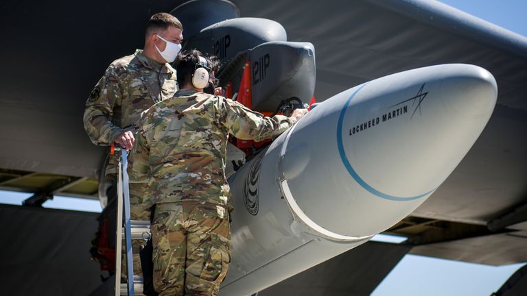 Master Sgt. John Malloy and Staff Sgt. Jacob Puente, both from 912th Aircraft Maintenance Squadron, secure the AGM-183A Air-launched Rapid Response Weapon Instrumented Measurement Vehicle 2 (ARRW IMV-2) as it is loaded under the wing of a B-52H Stratofortress at Edwards Air Force Base, California, U.S., August 6, 2020. Picture taken August 6, 2020. U.S. Air Force/Giancarlo Casem/Handout via REUTERS