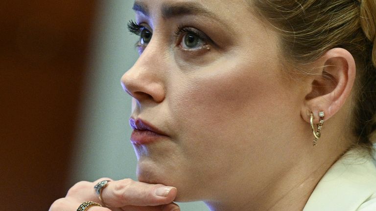 Actor Amber Heard listens in the courtroom during ex-husband Johnny Depp&#39;s defamation trial against her, at the Fairfax County Circuit Courthouse in Fairfax, Virginia, U.S., April 26, 2022. Brendan Smialowski/ Pool via REUTERS
