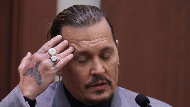 Actor Johnny Depp takes a stand during his defamation trial against his ex-wife Amber Heard at the Fairfax County Circuit Courthouse in Fairfax, Virginia, U.S., April 20, 2022. REUTERS/Evelyn Hockstein/Pool
