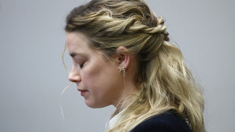 Actor Amber Heard reacts during the 50 million US dollar Depp vs Heard defamation trial at the Fairfax County Circuit Court in Fairfax, Virginia, U.S., April 21, 2022. Jim Lo Scalzo/Pool via REUTERS
