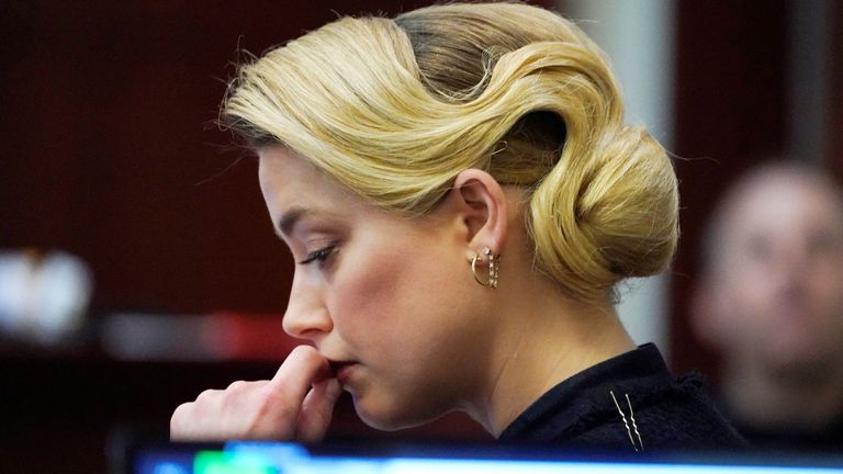 Actor Amber Heard listens in the courtroom during ex-husband Johnny Depp&#39;s defamation trial against her, at the Fairfax County Circuit Courthouse in Fairfax, Virginia, U.S., April 25, 2022. Steve Helber/Pool via REUTERS
