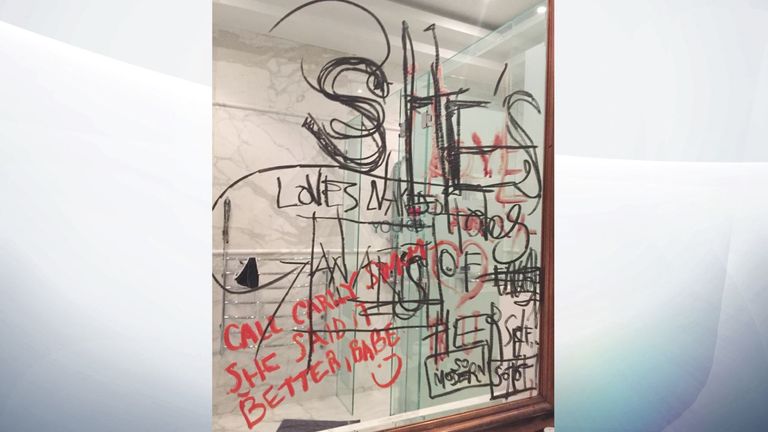 Writing scrawled in black oil paint and red lipstick on the mirror of Depp&#39;s home in Australia