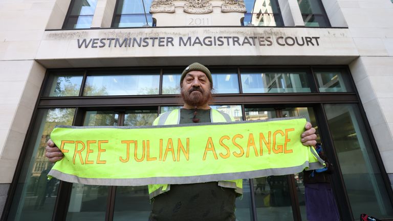A supporter of Wikileaks founder Julian Assange protests outside Westminster Magistrates' Court in London, ahead of his continuing extradition hearing. Picture date: Wednesday April 20, 2022.

