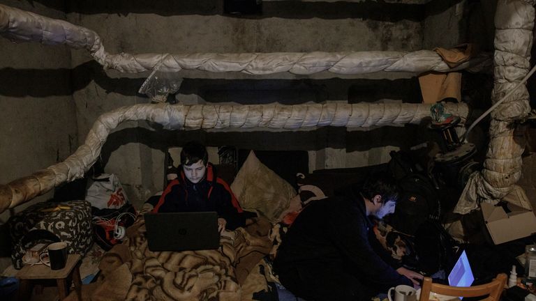 Programming students Vladislav and Vitali Mamin study in their bomb shelter  in Kharkiv Ukraine on 28 March