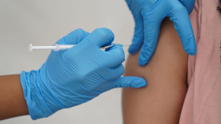 A person receives a Covid-19 jab at a pop-up vaccination centre during a four-day vaccine festival in Langdon Park, Poplar, east London. Picture date: Saturday July 31, 2021.
