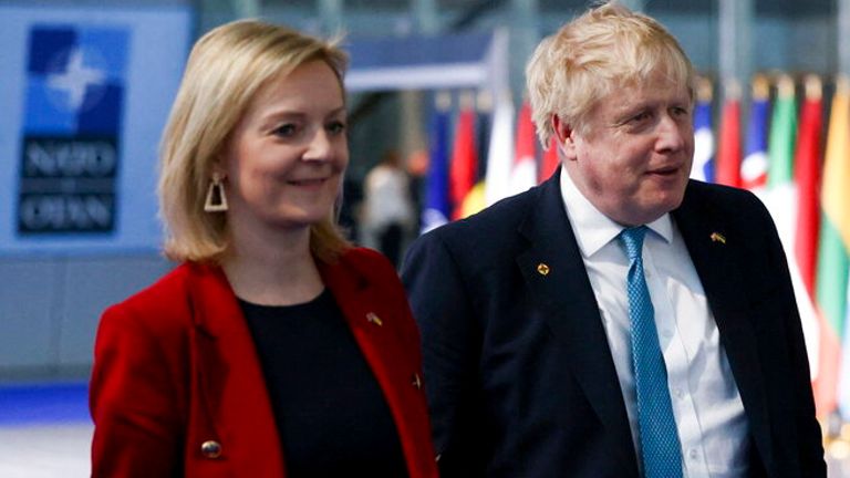 Foreign Secretary Liz Truss and PM Boris Johnson leave NATO headquarters together on 24 March. Pic: AP