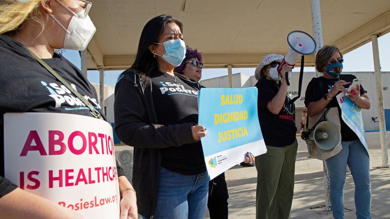 Protesters stand outside the Starr County Jail after Lizelle Herrerra, 26, was charged with murder for allegedly performing what authorities called a "self-induced abortion", in Rio Grande City, Texas, U.S. April 9, 2022. REUTERS/Jason Garza
