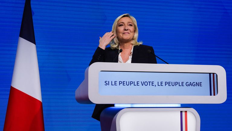 Marine Le Pen, leader of French far-right National Rally (Rassemblement National) party and candidate for the 2022 French presidential election, gestures during her speech as partial results in the first round of the 2022 French presidential election are announced, in Paris, in Paris, France, April 10, 2022. REUTERS/Pascal Rossignol