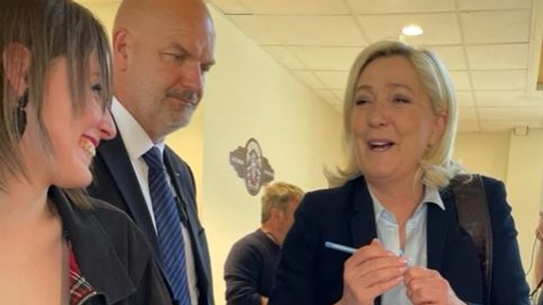 Marine le Pen signs autographs for supporters after meeting truckers near Roye
