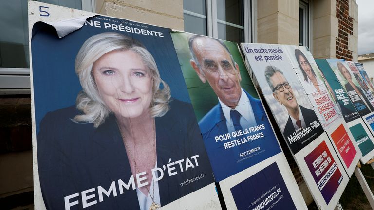 Official campaign posters of French presidential election candidates are seen on bulletin boards near the townhall in Appilly, France, April 6, 2022. REUTERS/Benoit Tessier

