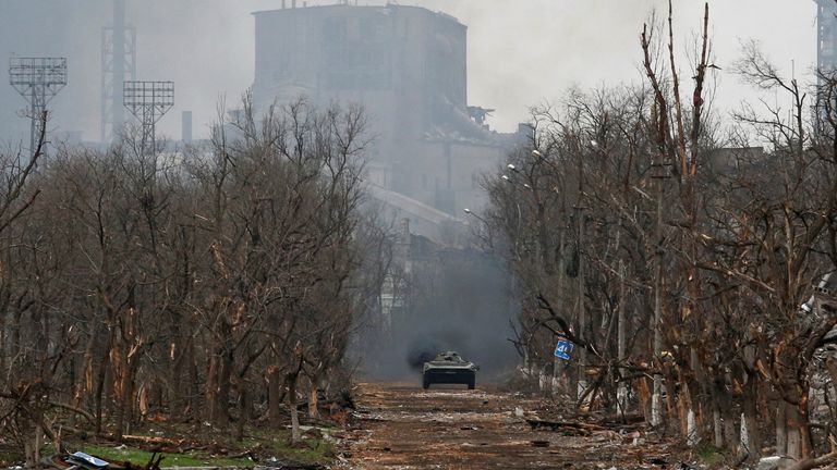 An armoured vehicle of pro-Russian troops drivers along a street during fighting in Ukraine-Russia conflict near a plant of Azovstal Iron and Steel Works company in the southern port city of Mariupol, Ukraine April 12, 2022. REUTERS/Alexander Ermochenko