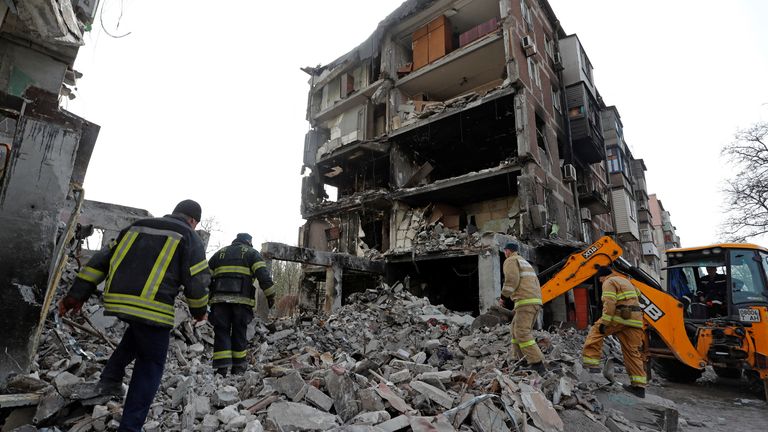 Rescuers work at a residential building damaged during Ukraine-Russia conflict in the southern port city of Mariupol, Ukraine April 19, 2022. REUTERS/Alexander Ermochenko
