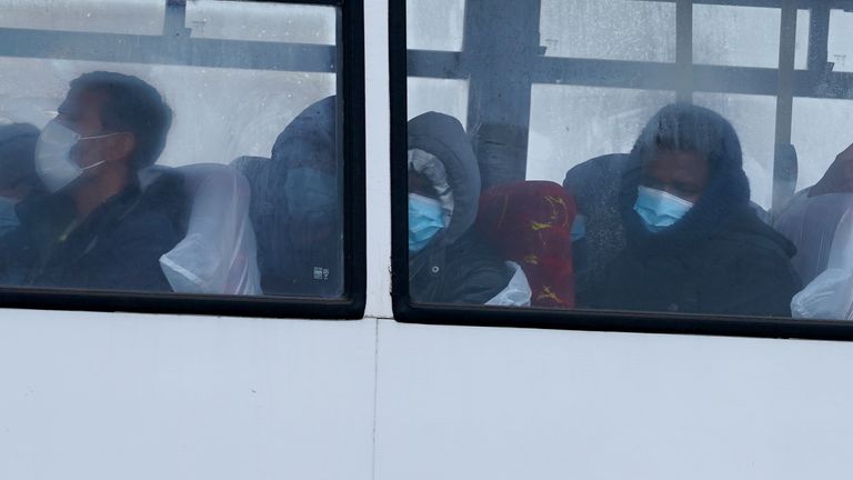 A group of people thought to be migrants are driven away by bus after being brought in to Dover, Kent, by Border Force officers in the Channel