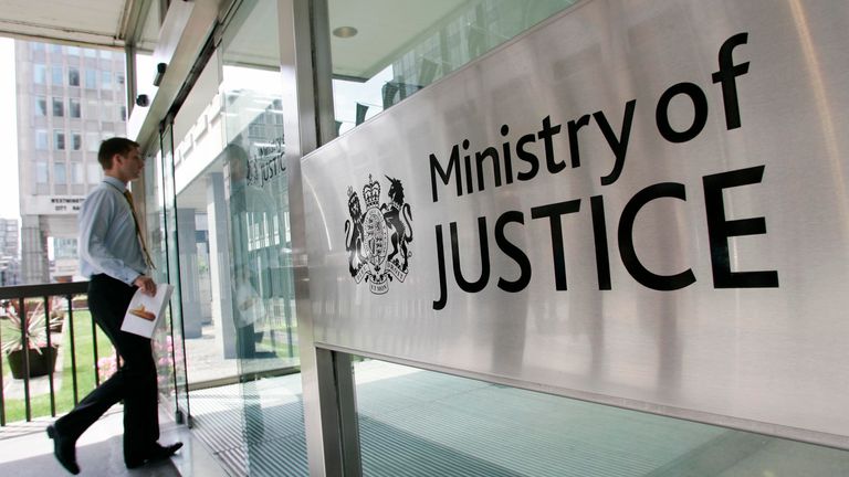 A man enters The Ministry of Justice in London June 19, 2007. Hundreds of criminals may be released early from jail in an attempt to ease overcrowding caused by record prison numbers in England and Wales, the government said on Tuesday. REUTERS/James Boardman (BRITAIN)