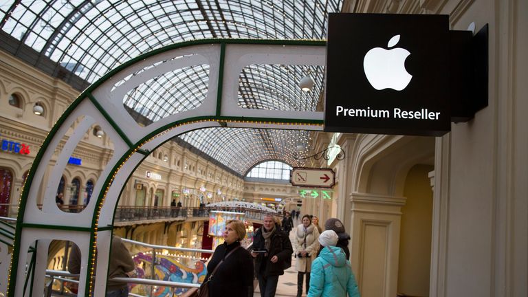 In this photo taken on Friday, Nov. 28, 2014, customers walk at an Apple Premium reseller inside the Moscow GUM State Department store in Moscow, Russia. Pic: AP
