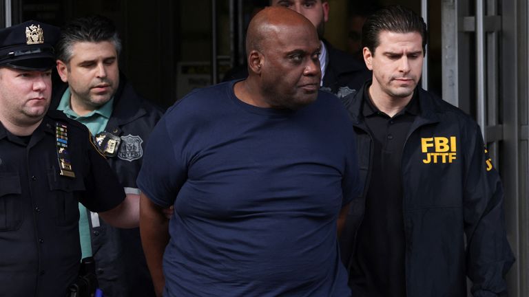 Frank James, the suspect in the Brooklyn subway shooting walks outside a police precinct in New York City, New York, U.S., April 13, 2022. REUTERS/Andrew Kelly